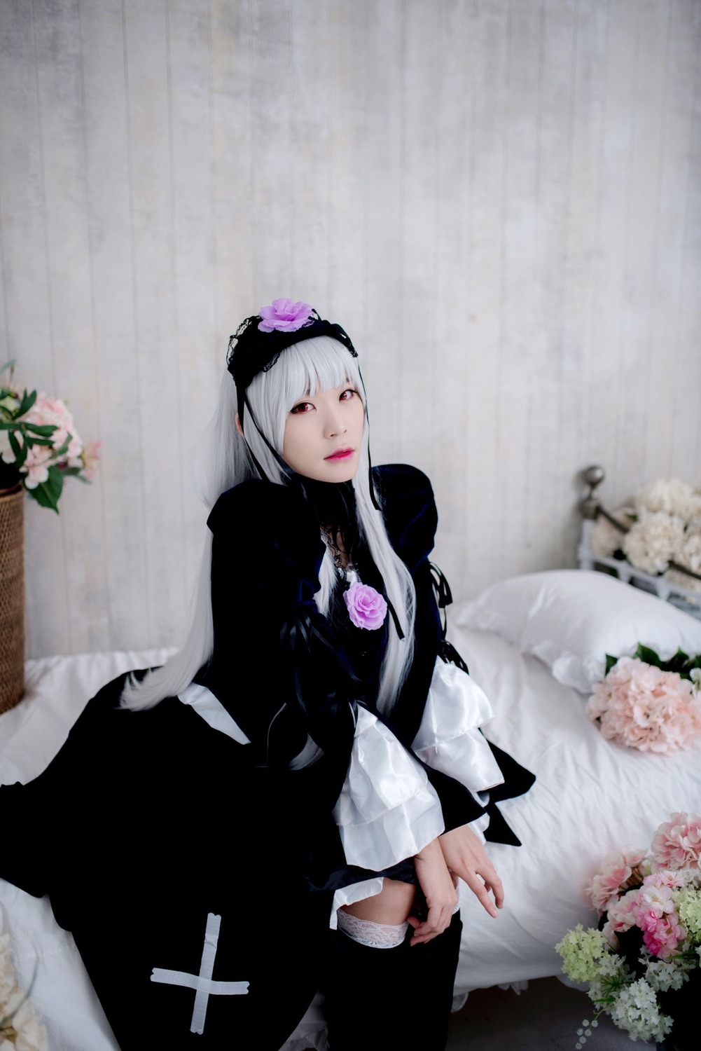 1girl bangs dress flower gothic_lolita hairband lips long_hair long_sleeves looking_at_viewer nail_polish red_eyes silver_hair solo suigintou