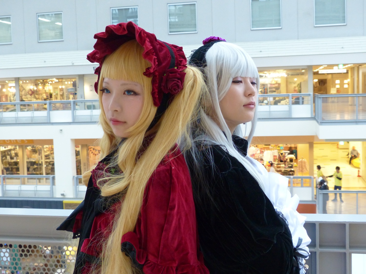 2girls bangs blonde_hair blue_eyes blunt_bangs bonnet building city flower hat indoors lips long_hair looking_at_viewer multiple_girls realistic rose shinku window