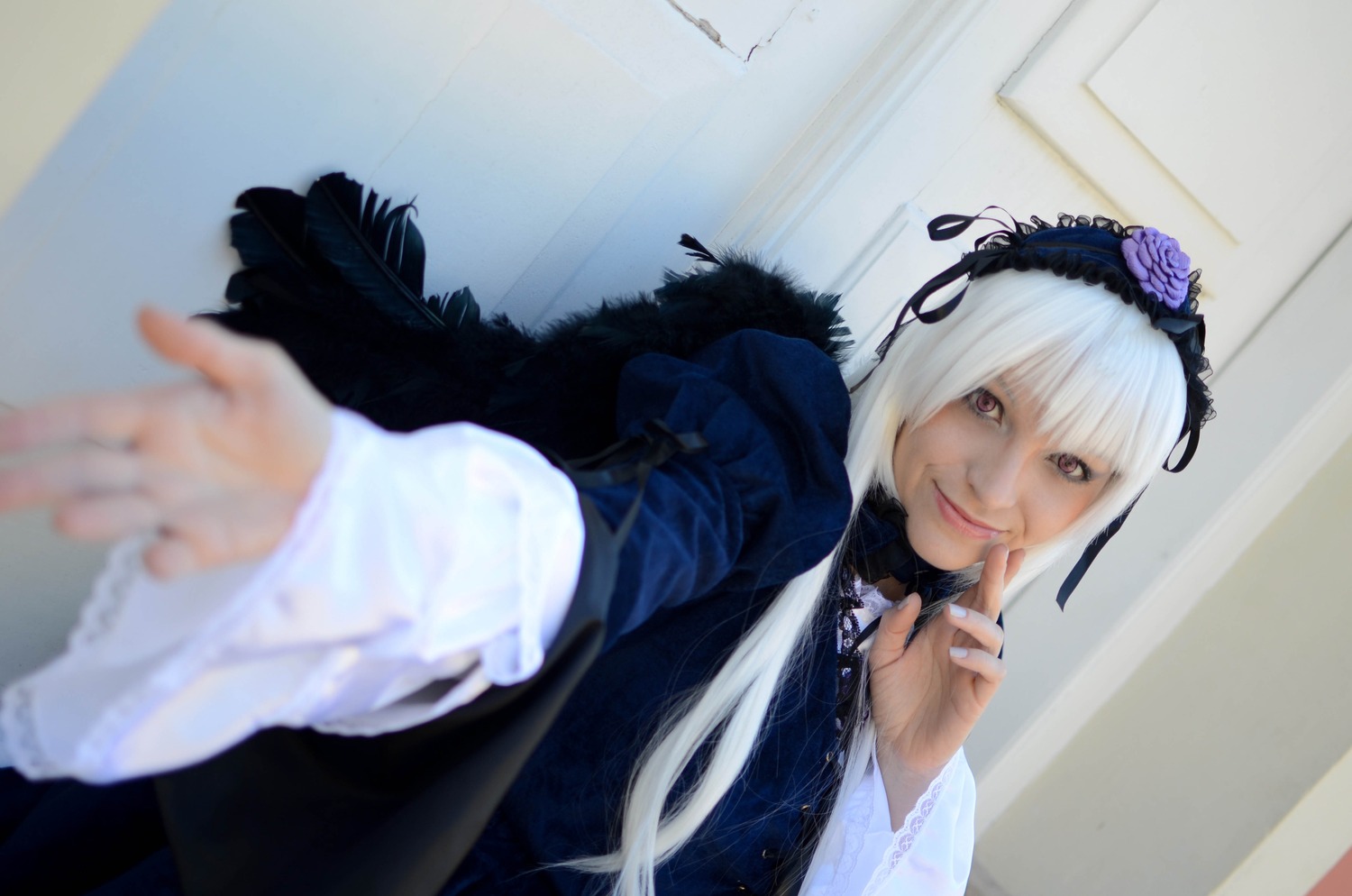 1girl 3d auto_tagged bangs blurry blurry_background blurry_foreground closed_mouth depth_of_field flower frills hairband long_sleeves looking_at_viewer photo pov rose smile solo suigintou white_hair