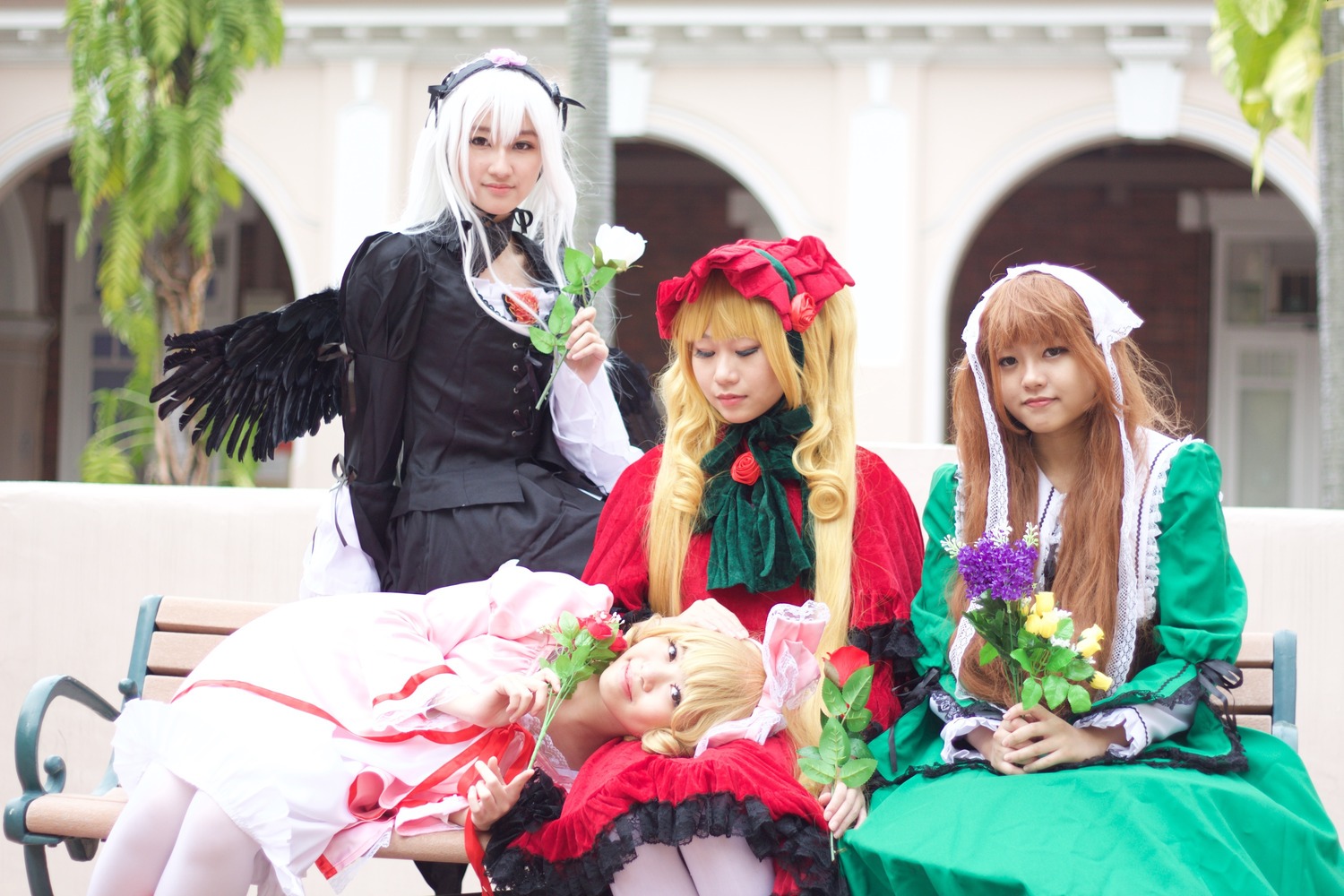 3girls angel_wings blonde_hair blurry chair depth_of_field dress feathers long_hair multiple_cosplay multiple_girls photo realistic shinku sitting suigintou tagme wings