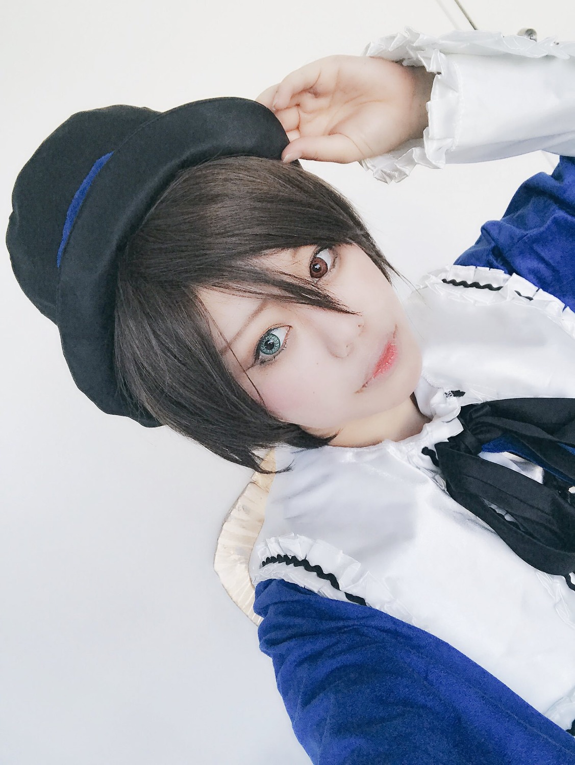 1girl beret black_hair black_headwear black_ribbon blue_headwear closed_mouth frills hair_between_eyes hat lips long_sleeves looking_at_viewer neck_ribbon realistic ribbon shirt short_hair solo souseiseki striped upper_body vertical_stripes white_shirt