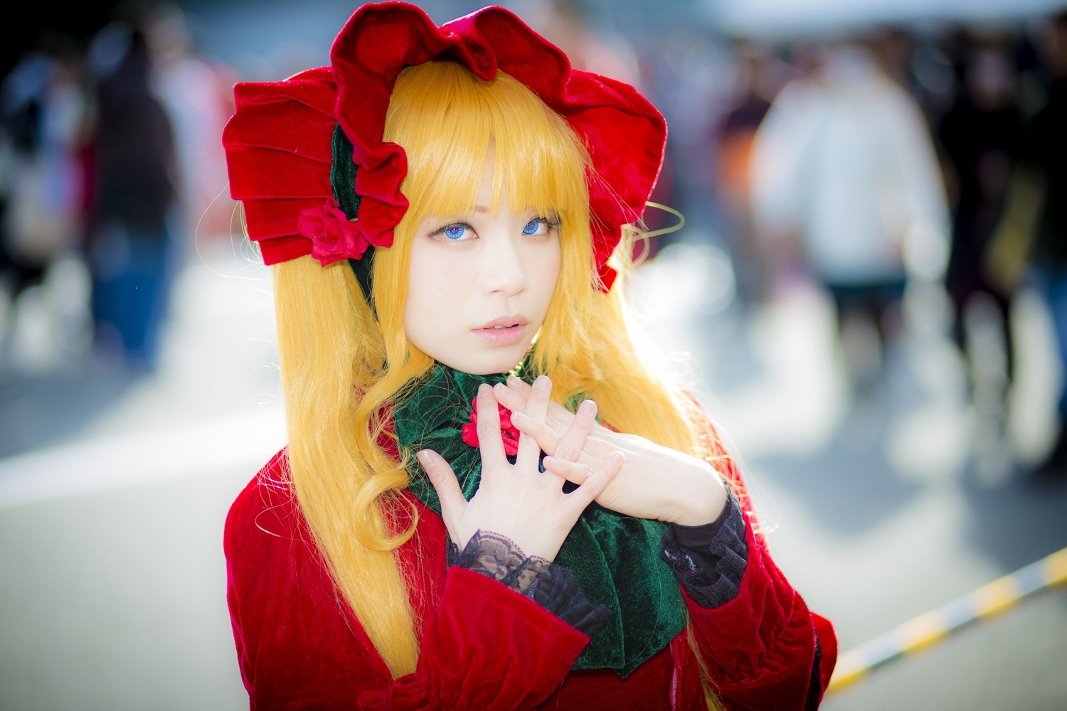 1girl bangs blonde_hair blue_eyes blurry blurry_background blurry_foreground bonnet depth_of_field dress flower hair_ornament lips long_hair photo red_dress red_flower red_rose rose shinku solo upper_body