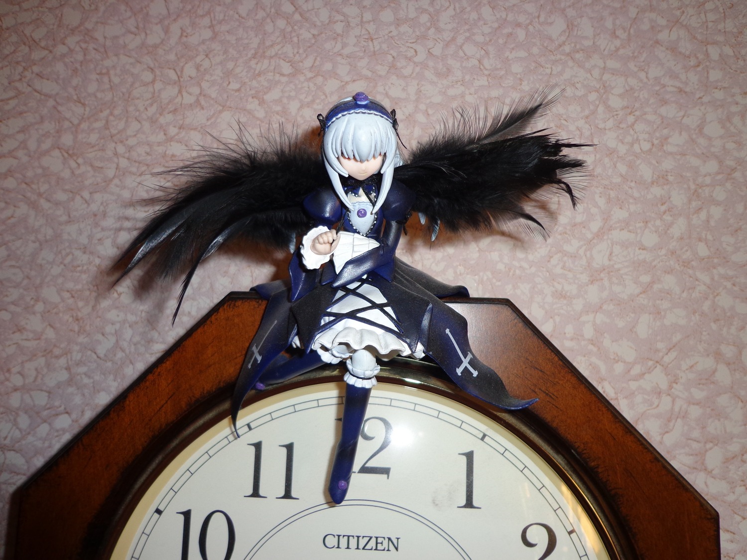 1girl black_wings boots doll dress feathered_wings feathers frills hair_over_eyes hat long_hair long_sleeves silver_hair sitting solo suigintou white_hair wings