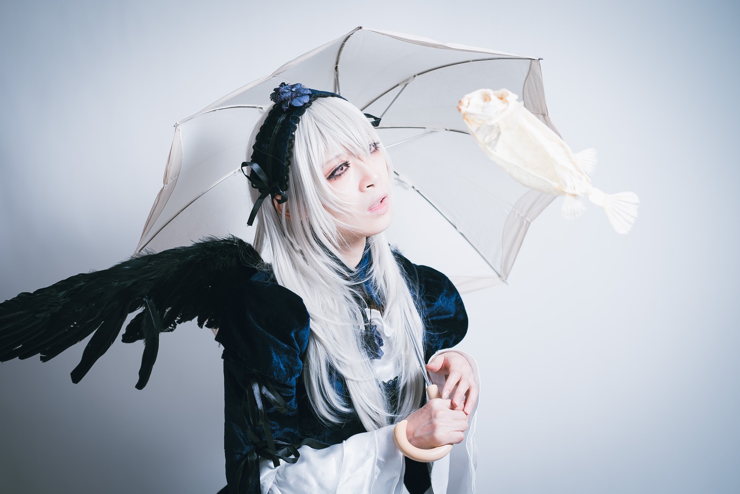 1girl bird bird_on_shoulder black_wings crow feathered_wings feathers flower holding_umbrella lips long_hair long_sleeves rain solo suigintou umbrella wings