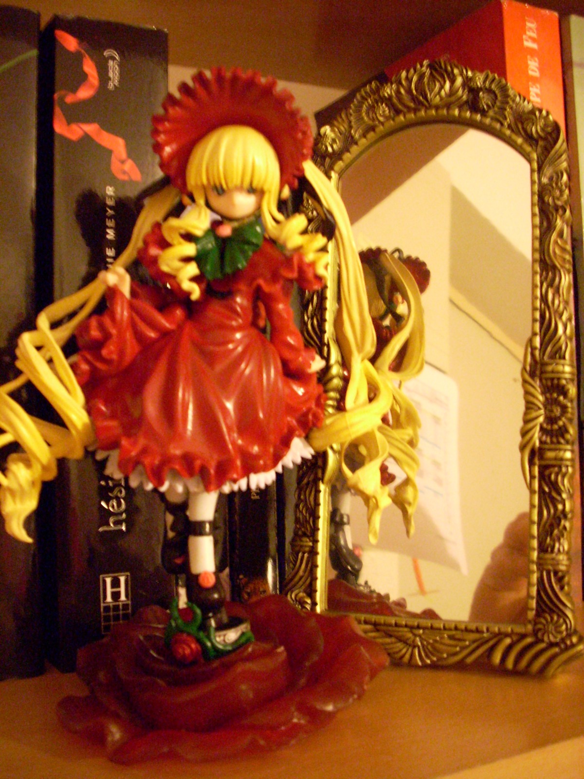 1girl blonde_hair bonnet bow bowtie doll dress flower long_hair long_sleeves red_dress rose shinku solo very_long_hair