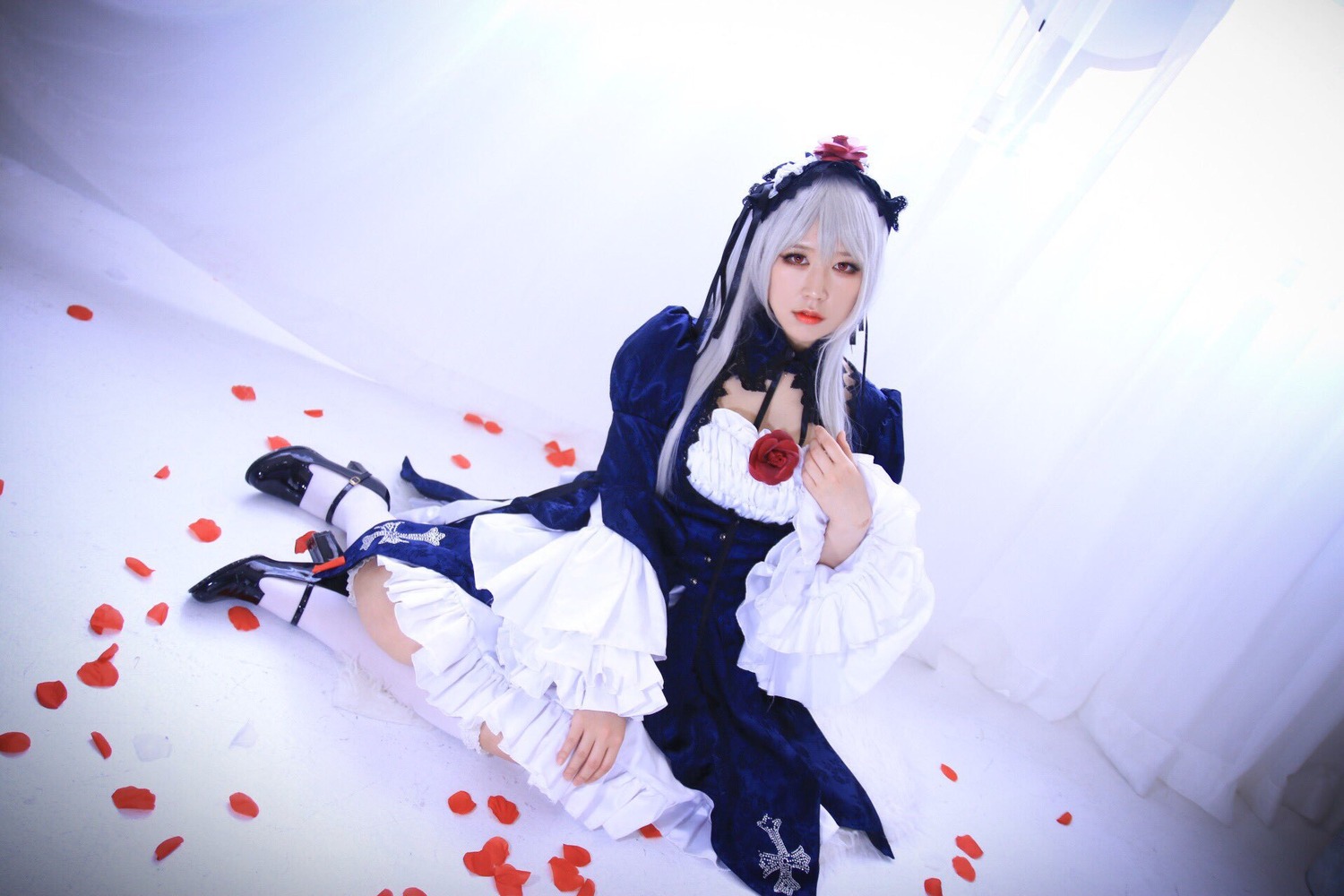 1girl dress flower frills lips long_hair long_sleeves petals rose rose_petals silver_hair sitting solo suigintou