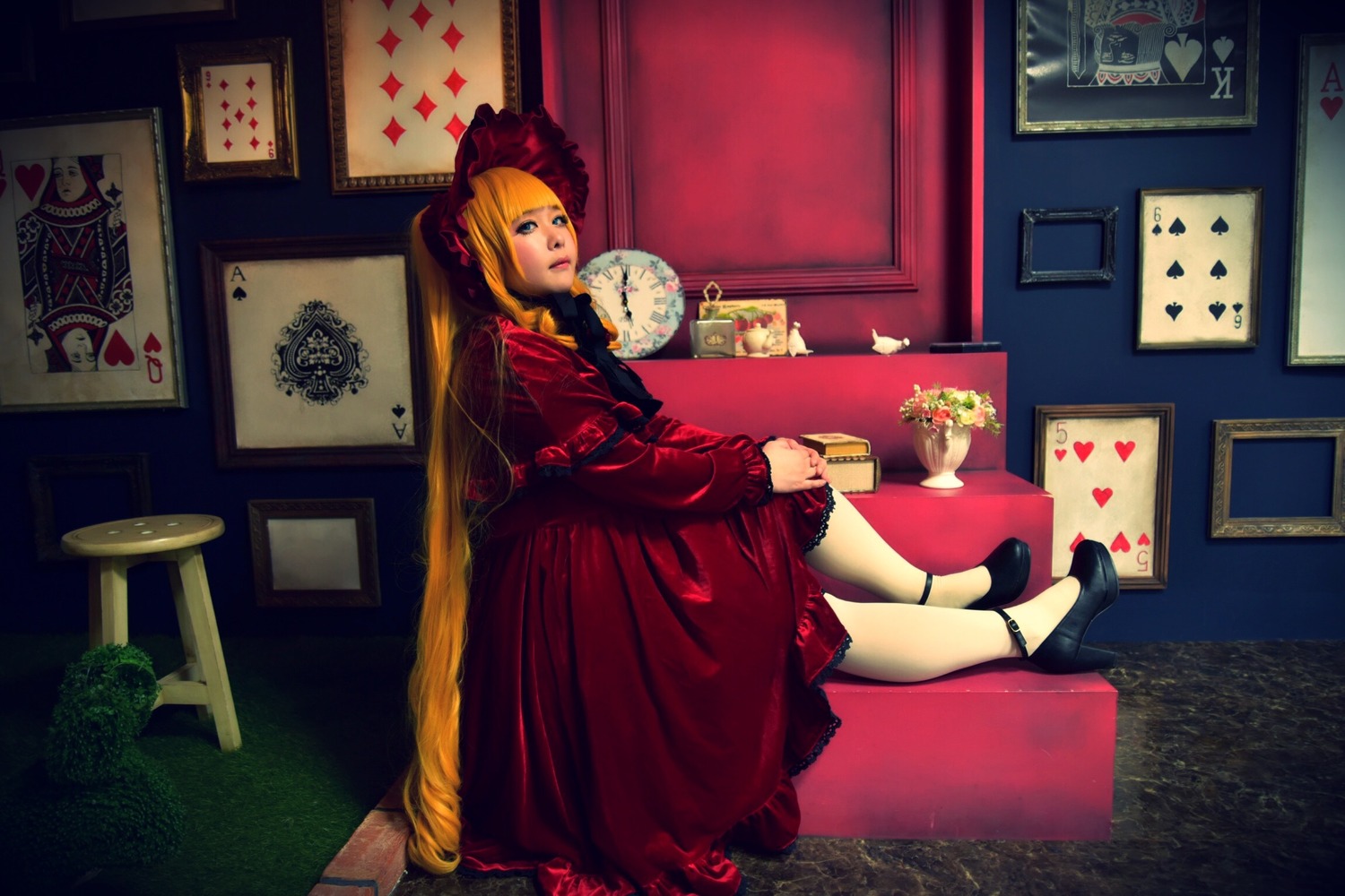 1girl blonde_hair blue_eyes dress indoors long_hair painting_(object) photo_(object) picture_frame red_dress shinku shoes sitting solo