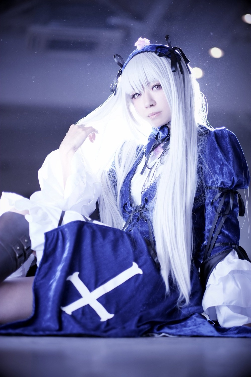 1girl dress flower frills hairband long_hair long_sleeves looking_at_viewer ribbon sitting solo suigintou