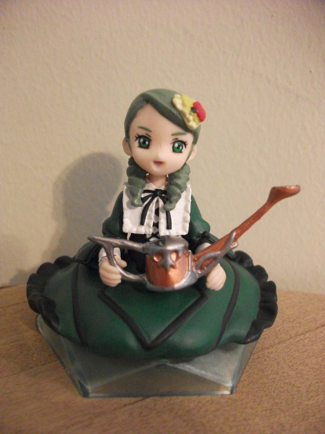 1girl doll dress flower frills green_dress green_eyes kanaria long_sleeves sitting solo