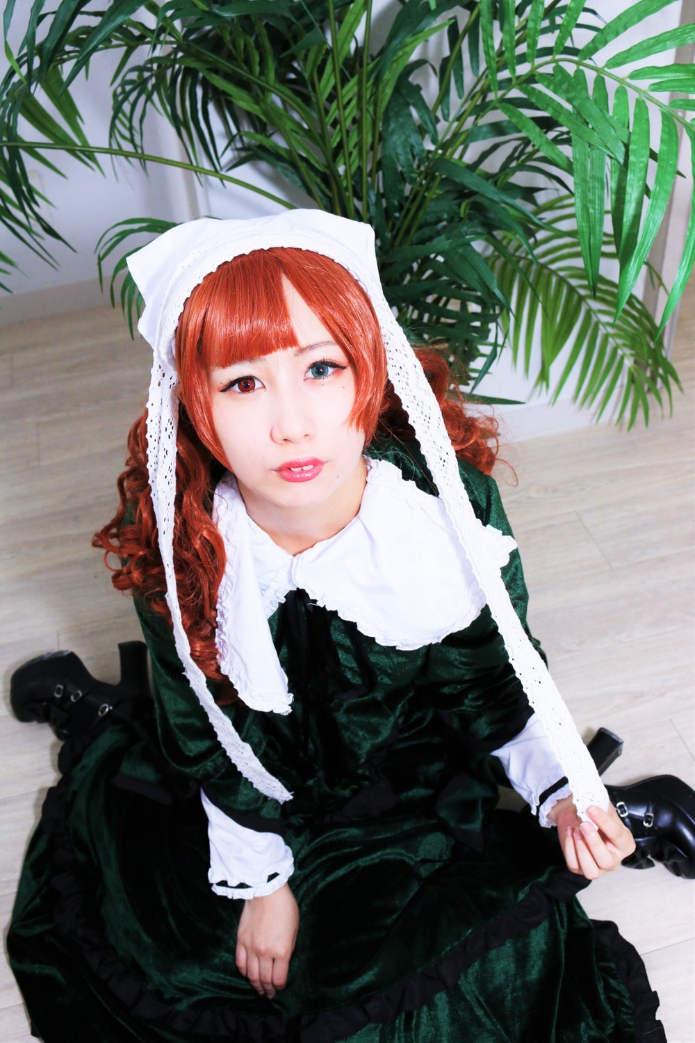 1girl bangs dress lips long_hair long_sleeves looking_at_viewer plant red_eyes red_hair sitting solo suiseiseki