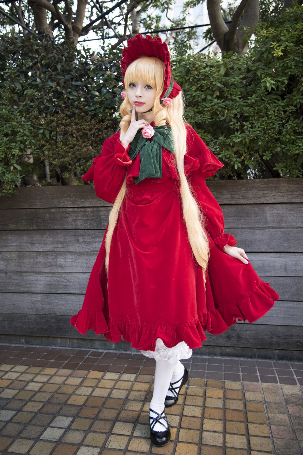1girl blonde_hair blue_eyes bonnet bow capelet dress flower full_body long_hair long_sleeves looking_at_viewer outdoors pantyhose red_dress shinku shoes solo standing tile_floor tiles tree white_legwear