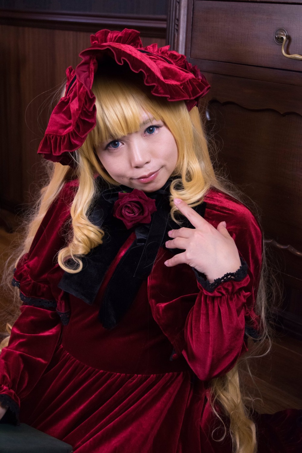 1girl bangs blonde_hair blue_eyes bonnet bow dress flower lips long_hair long_sleeves looking_at_viewer red_dress red_flower red_rose rose shinku solo