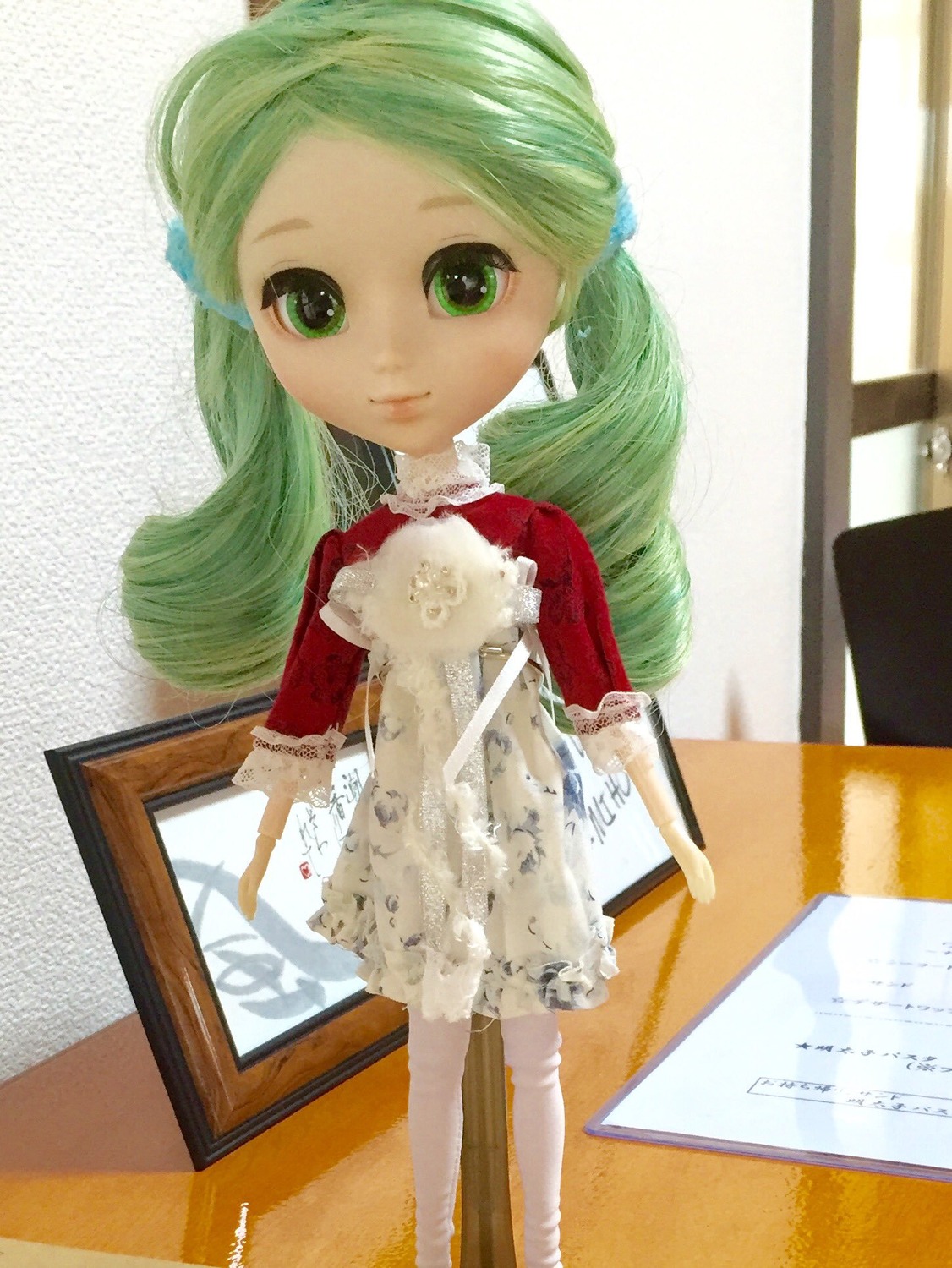 1girl doll frills green_eyes green_hair hair_ornament kanaria long_hair looking_at_viewer photo smile solo standing twintails
