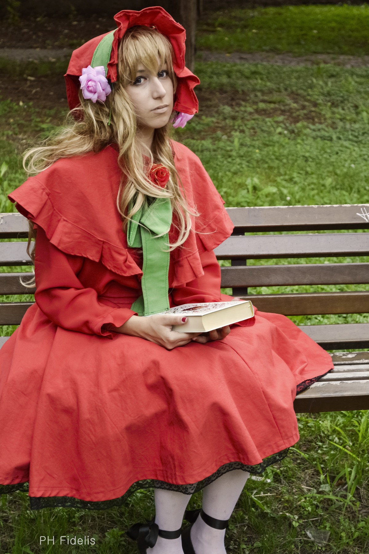 1girl blonde_hair blue_eyes bonnet bow dress flower long_hair nature pink_dress red_dress shinku sitting solo