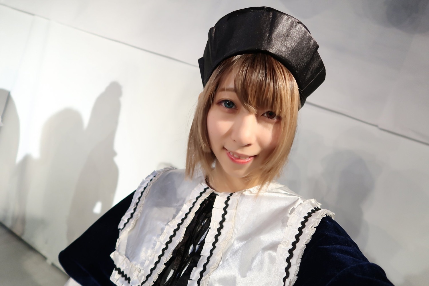1girl bangs beanie black_headwear blonde_hair blue_eyes hat lips looking_at_viewer photo realistic short_hair smile solo souseiseki upper_body