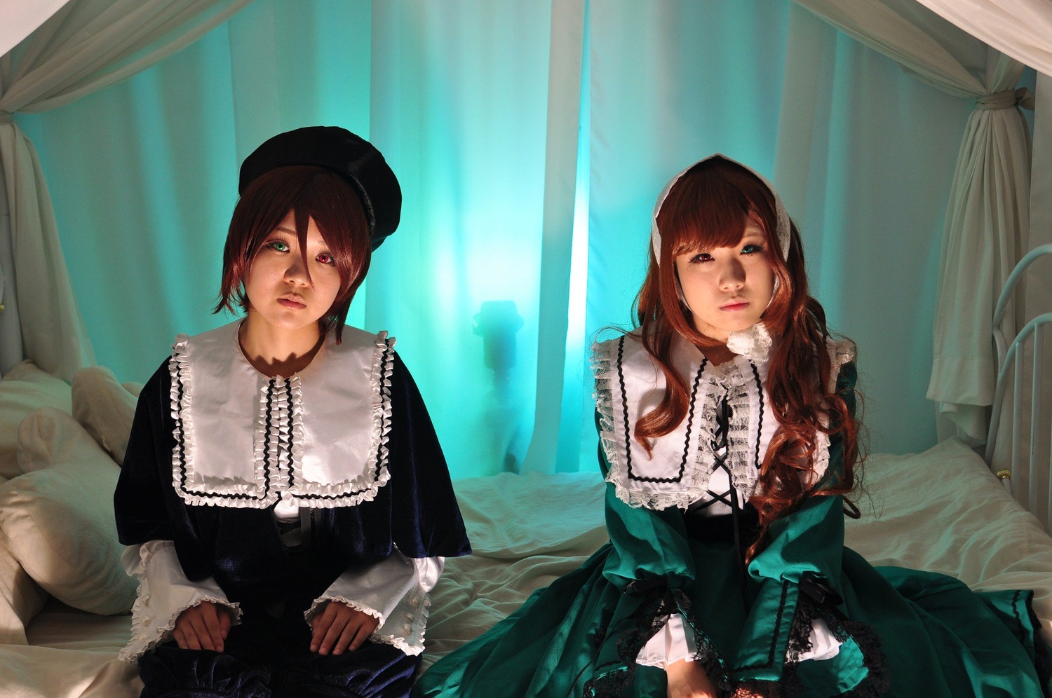 2girls bangs brown_hair curtains dress frills green_eyes hat heterochromia indoors lips long_hair long_sleeves multiple_cosplay multiple_girls siblings sisters tagme twins window