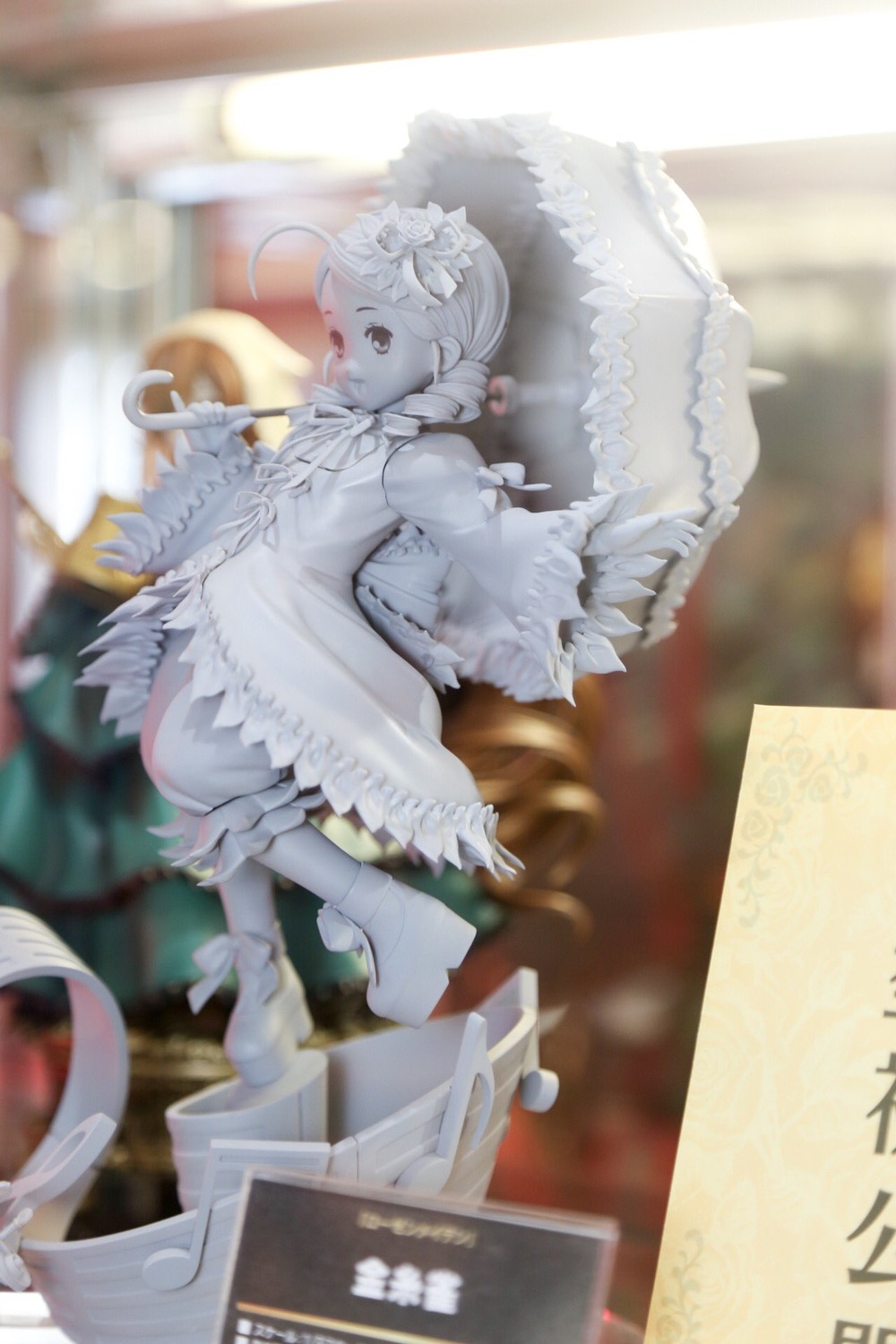 1girl blurry blurry_background blurry_foreground depth_of_field doll dress flower frilled_dress frills hair_ornament kanaria long_sleeves motion_blur pale_skin photo solo white_dress white_hair wings