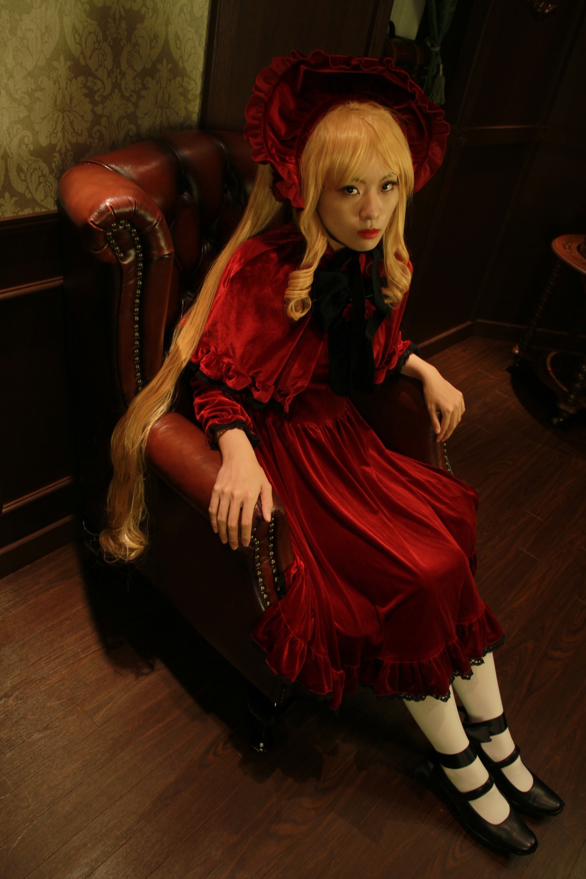 1girl blonde_hair blue_eyes bonnet chair dress flower frills lips long_hair looking_at_viewer red_dress rose shinku shoes sitting solo