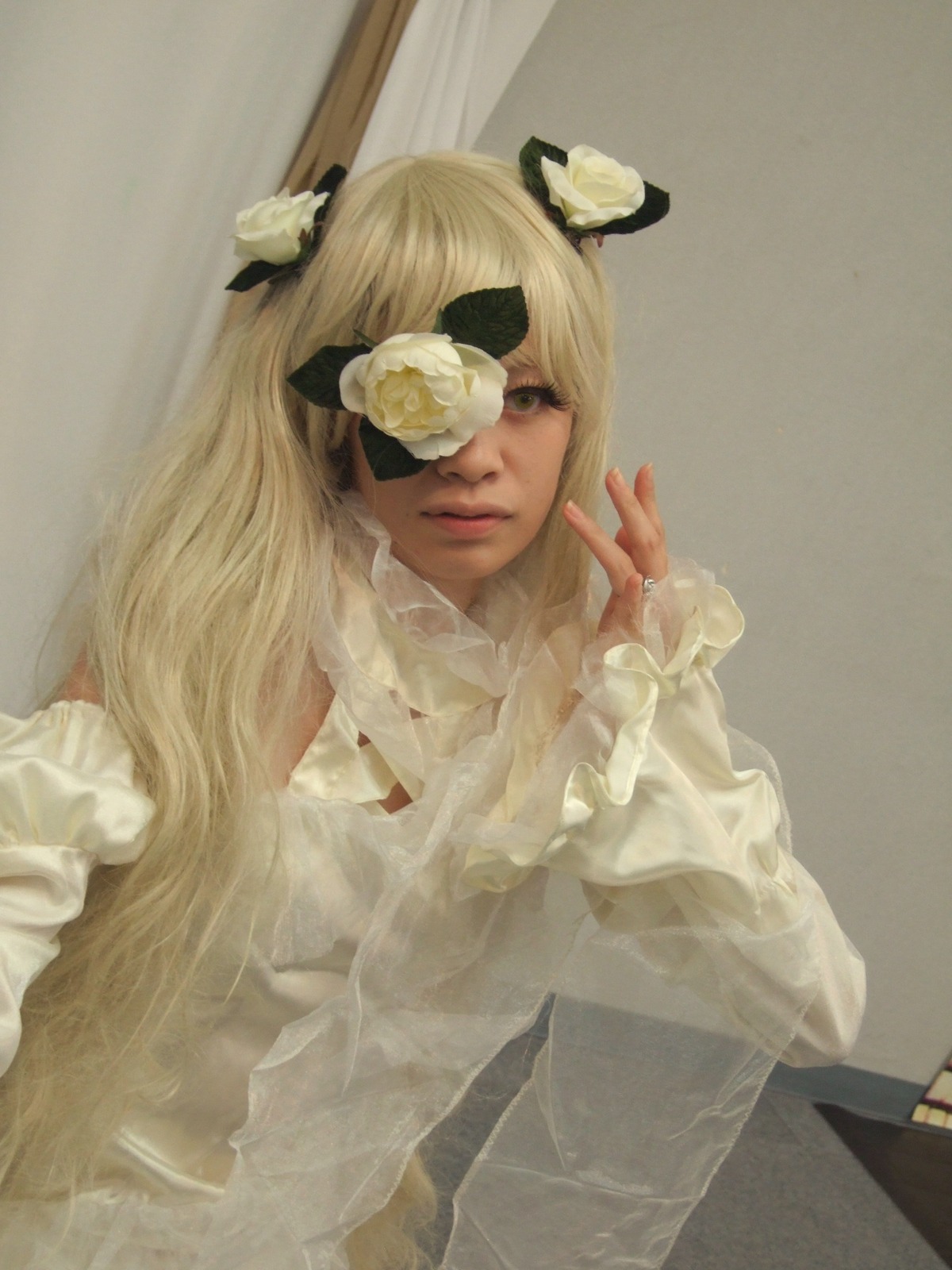 1girl bangs blonde_hair closed_mouth dress eyepatch flower hair_flower hair_ornament kirakishou lips long_hair long_sleeves photo realistic sitting solo white_flower white_rose