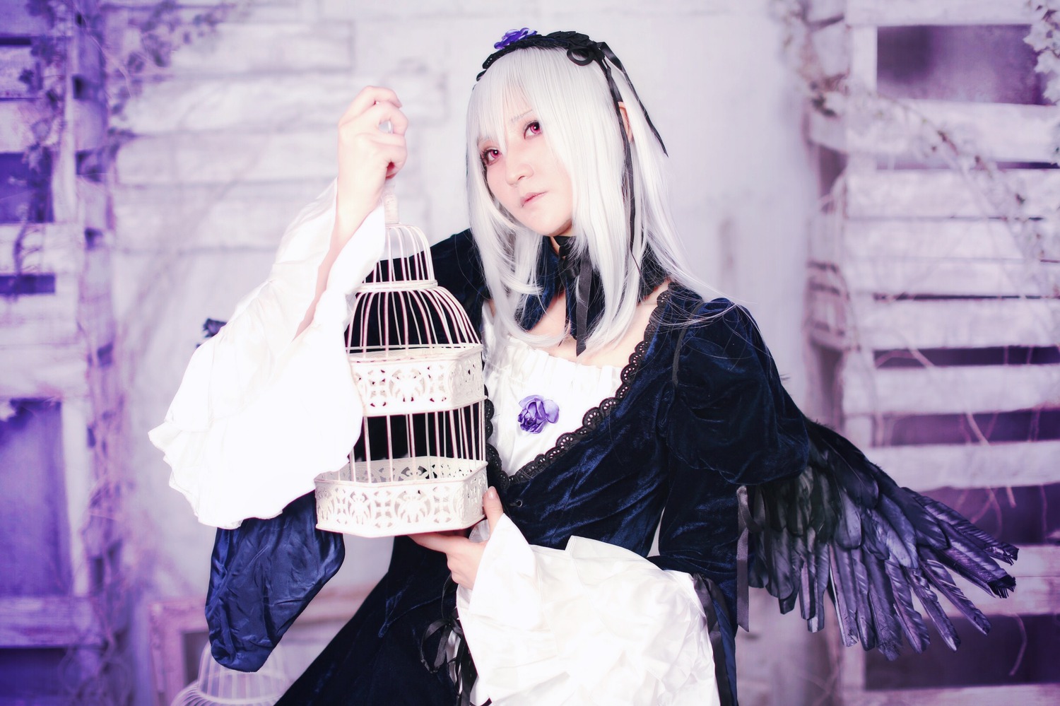 1girl 3d black_dress blurry blurry_background blurry_foreground depth_of_field detached_collar dress fan flower hairband long_hair long_sleeves nail_polish red_eyes solo suigintou wide_sleeves wings