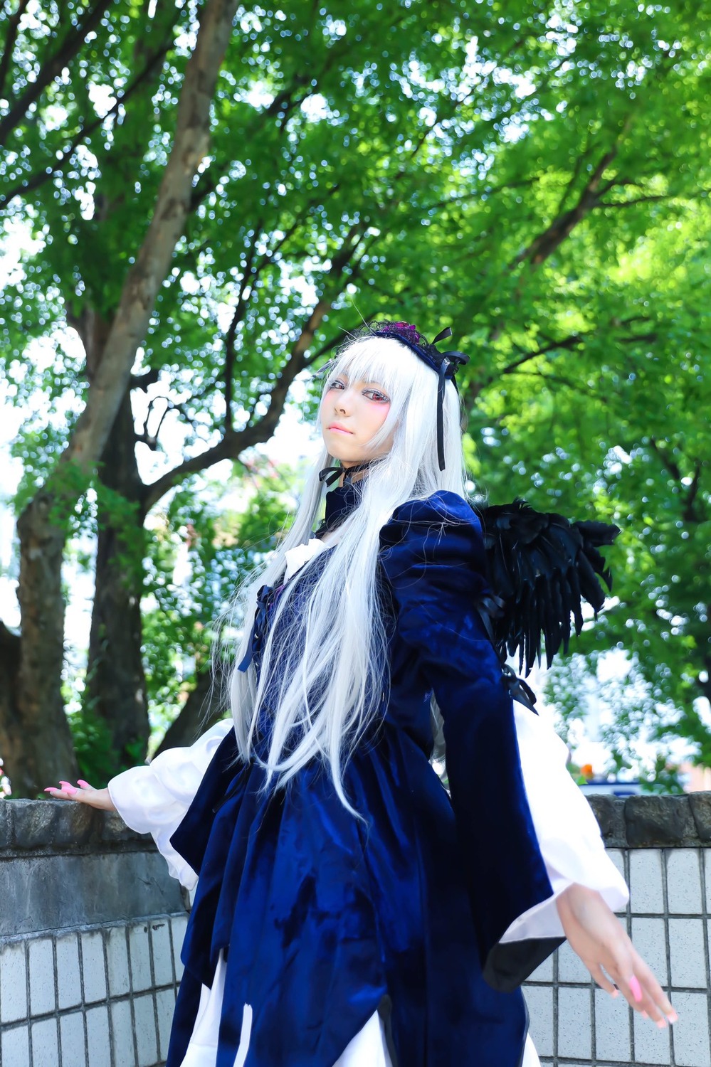 1girl bangs dress flower hairband long_hair long_sleeves looking_at_viewer outdoors solo standing suigintou tree white_hair wings