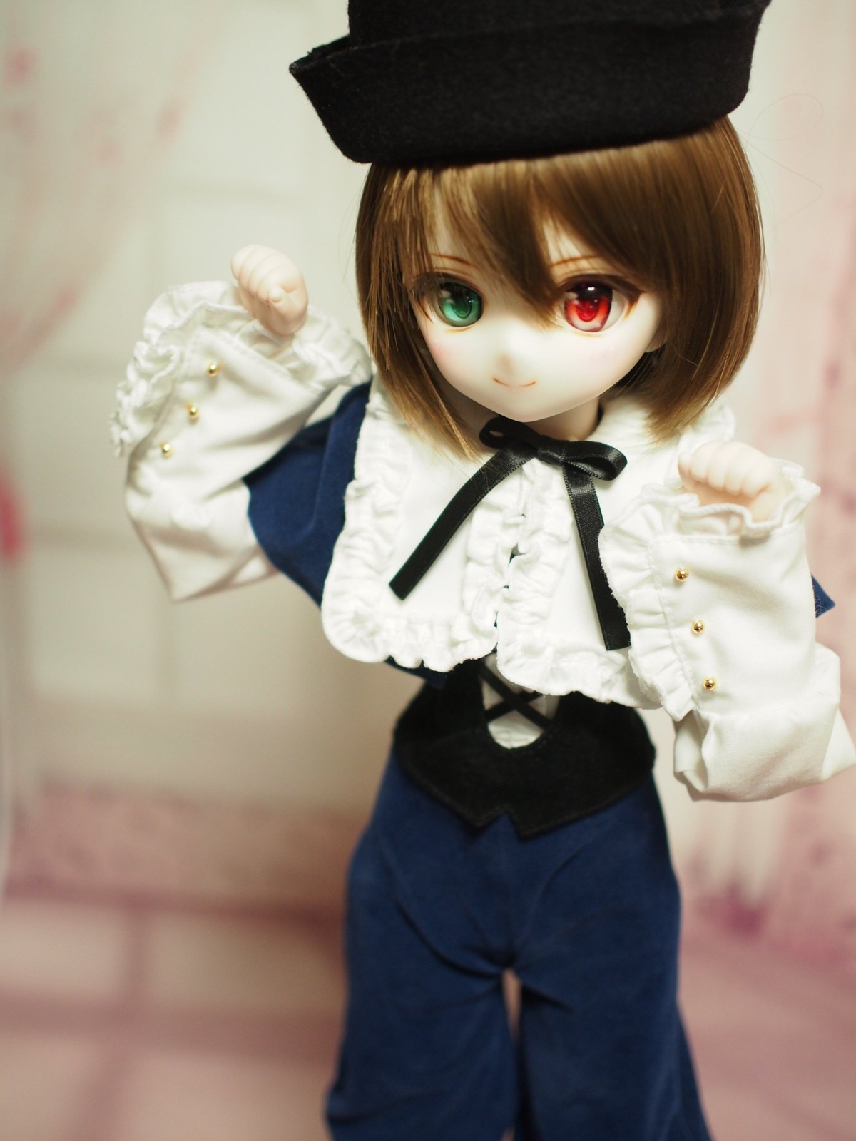 1girl bangs blurry brown_hair depth_of_field doll frills green_eyes hat heterochromia long_sleeves looking_at_viewer pants red_eyes ribbon shirt short_hair smile solo souseiseki standing suiseiseki