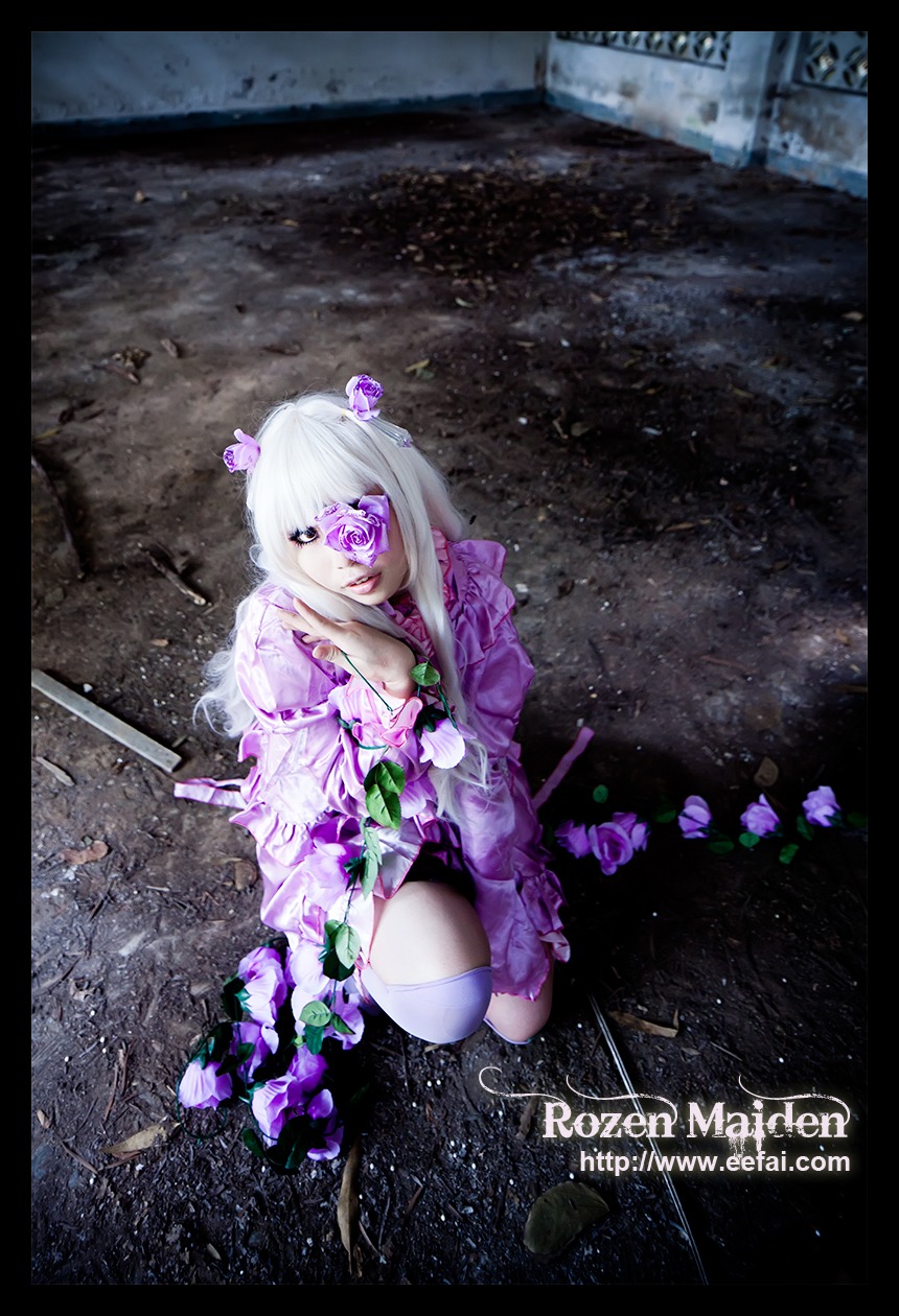 1girl barasuishou black_border copyright_name eyepatch flower hair_flower hair_ornament letterboxed pillarboxed purple_eyes rain rose solo weapon