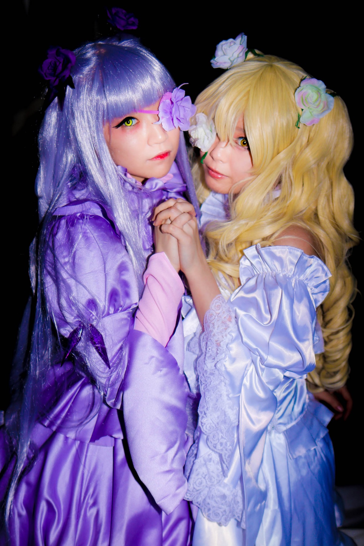 2girls 91076 bangs blonde_hair dress eyepatch flower hair_flower hair_ornament holding_hands interlocked_fingers lips long_hair long_sleeves looking_at_viewer multiple_cosplay multiple_girls nail_polish ring tagme yellow_eyes