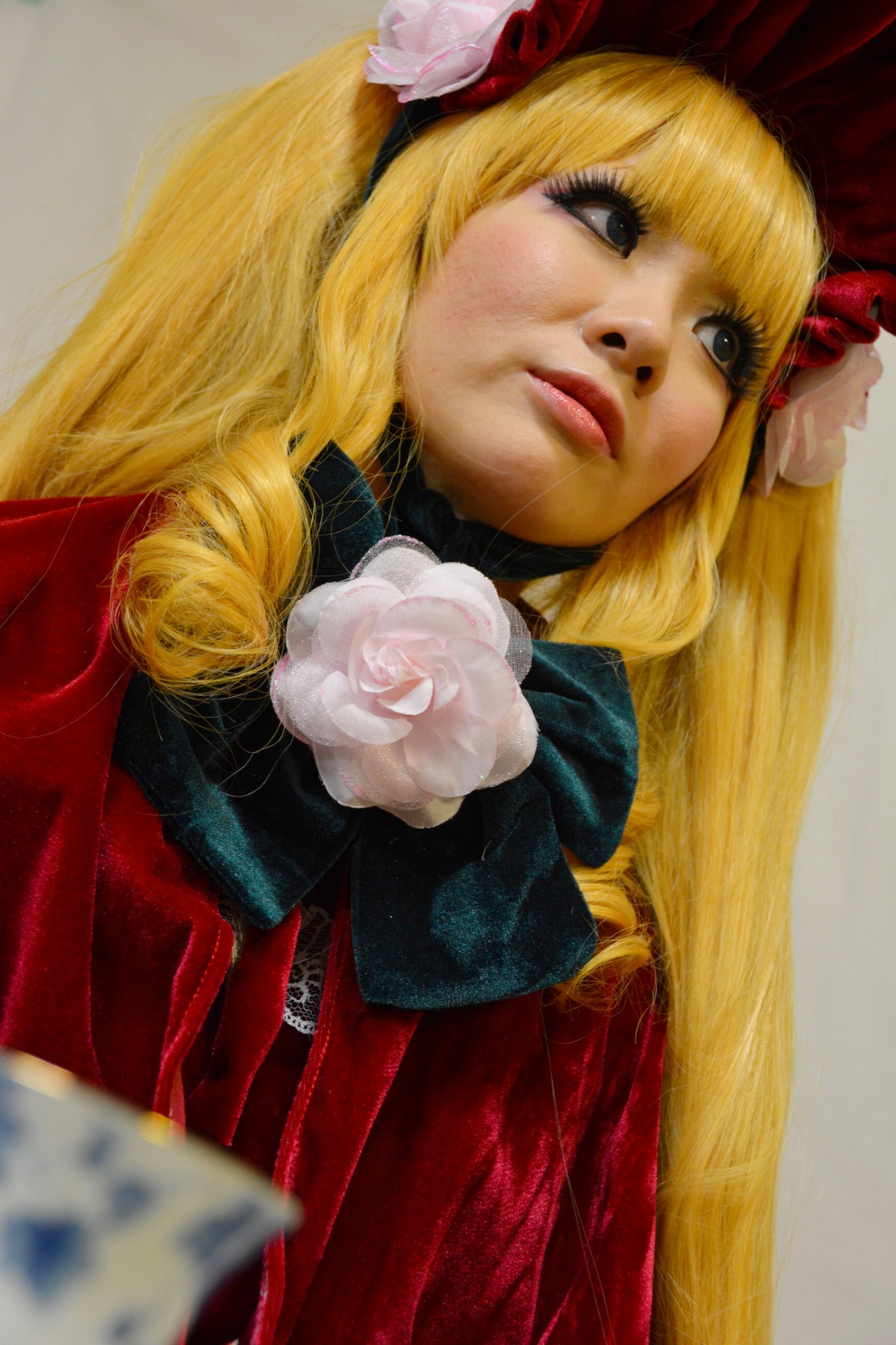 1girl bangs blonde_hair flower lips long_hair photo realistic rose shinku simple_background solo