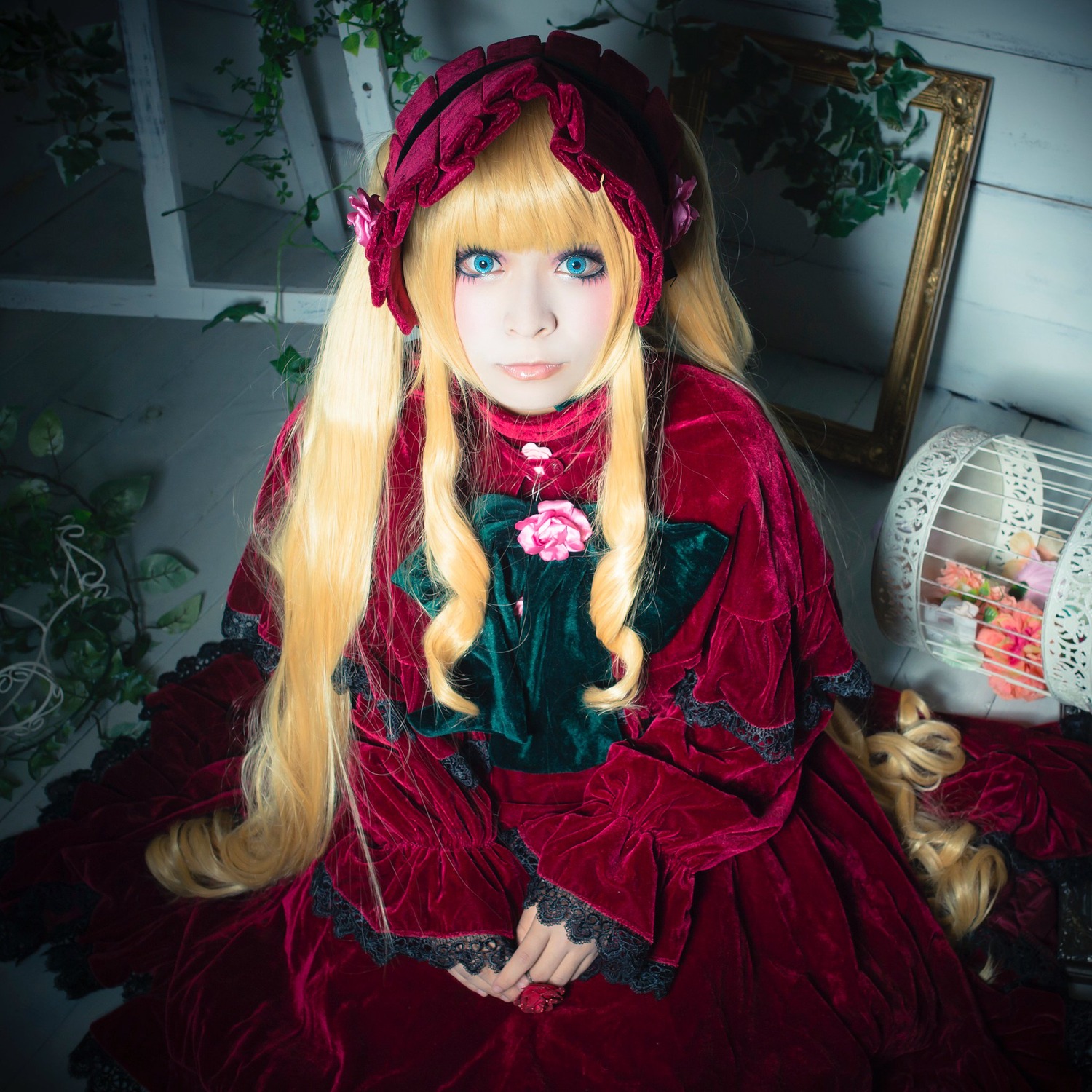 1girl blonde_hair blue_eyes bonnet dress drill_hair flower lolita_fashion long_hair long_sleeves looking_at_viewer red_dress rose shinku smile solo