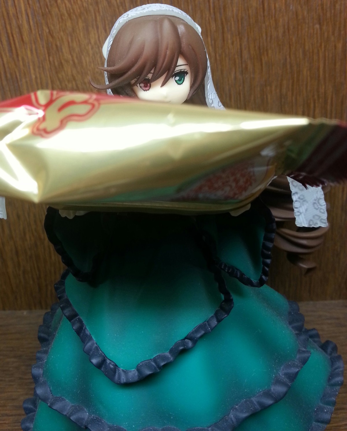 1girl brown_hair dress frills green_dress hairband heterochromia image in_container long_hair long_sleeves mermaid monster_girl photo red_eyes solo souseiseki suiseiseki