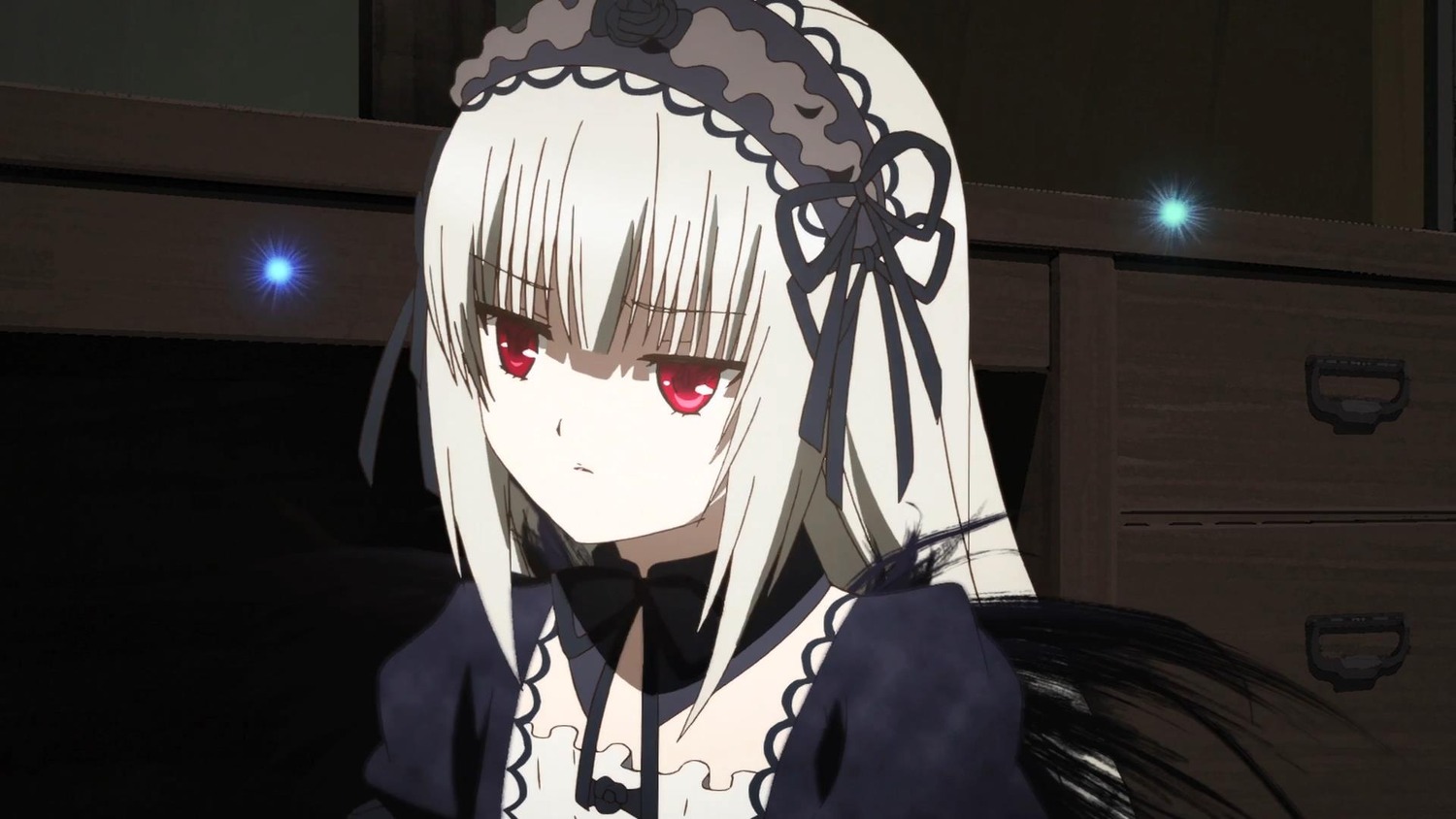 1girl auto_tagged bangs black_dress black_ribbon closed_mouth detached_collar dress eyebrows_visible_through_hair hairband image indoors long_hair long_sleeves looking_at_viewer red_eyes ribbon silver_hair solo suigintou