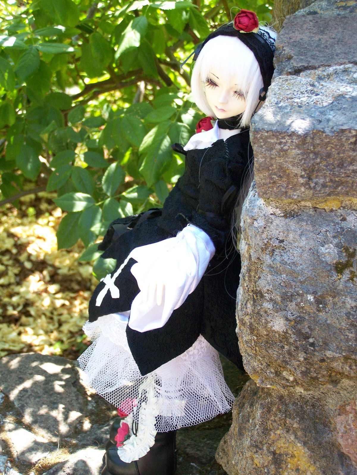 1girl black_dress closed_eyes doll dress flower hairband long_sleeves outdoors rose short_hair solo standing suigintou white_hair