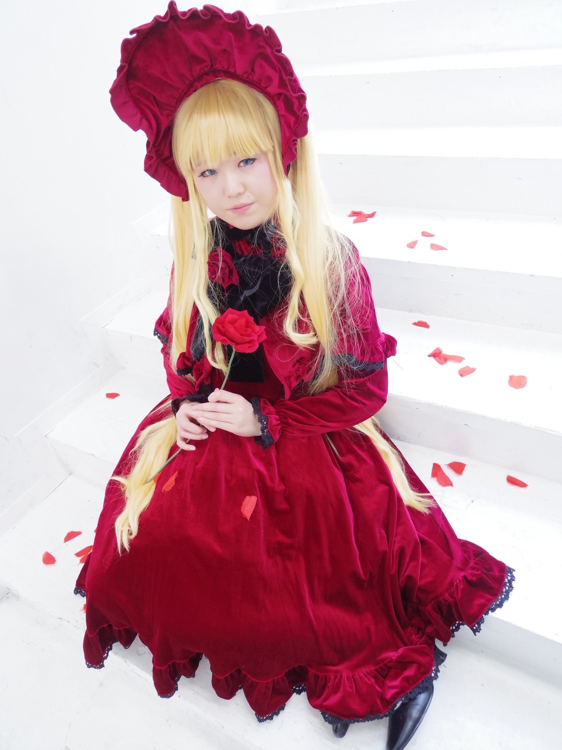 1girl blonde_hair blue_eyes bonnet dress flower lips long_hair looking_at_viewer petals red_dress rose shinku solo striped striped_background